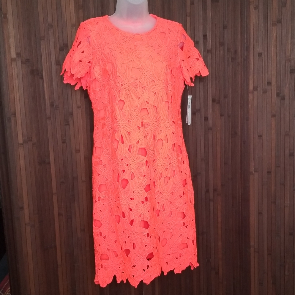 Brand new. Size 6 coral dress